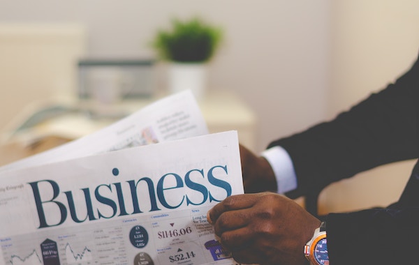 Attorney reading the business newspaper