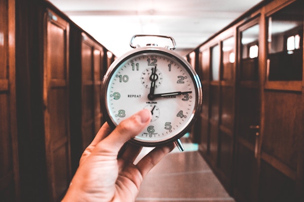 Personal injury lawyer holding clock in Huntsville AL