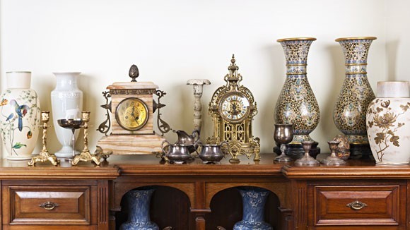 Vases and clocks on a mantel
