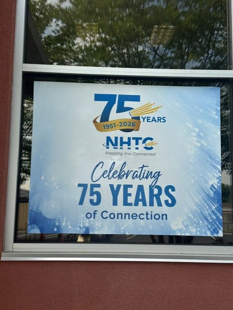 A sign celebrating 75 years of connection